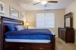 Master bedroom w/ king size bed, 40 HDTV, and attached full bathroom